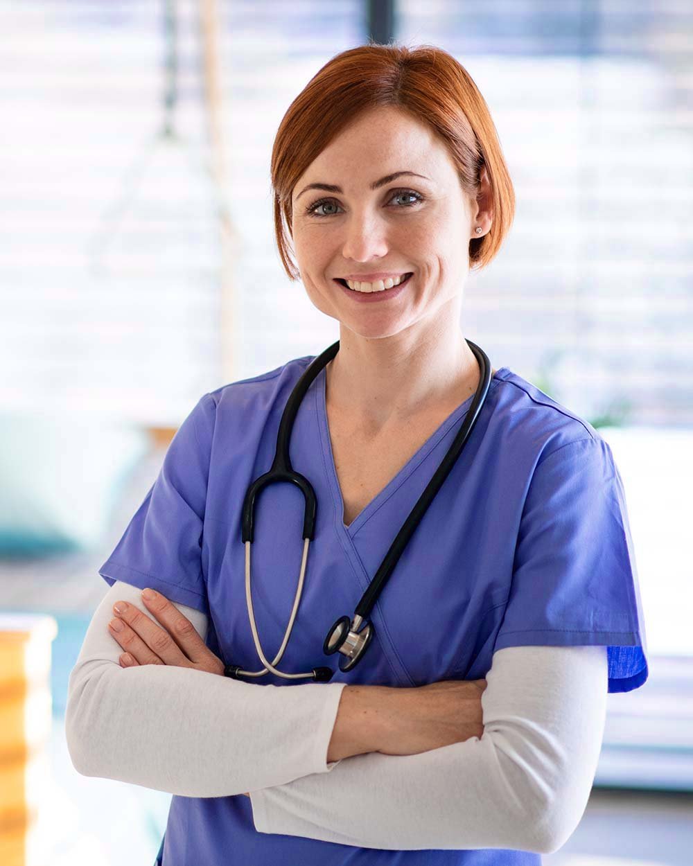 portrait-of-female-doctor-or-nurse-standing-in-hos-J37Z55D.jpg