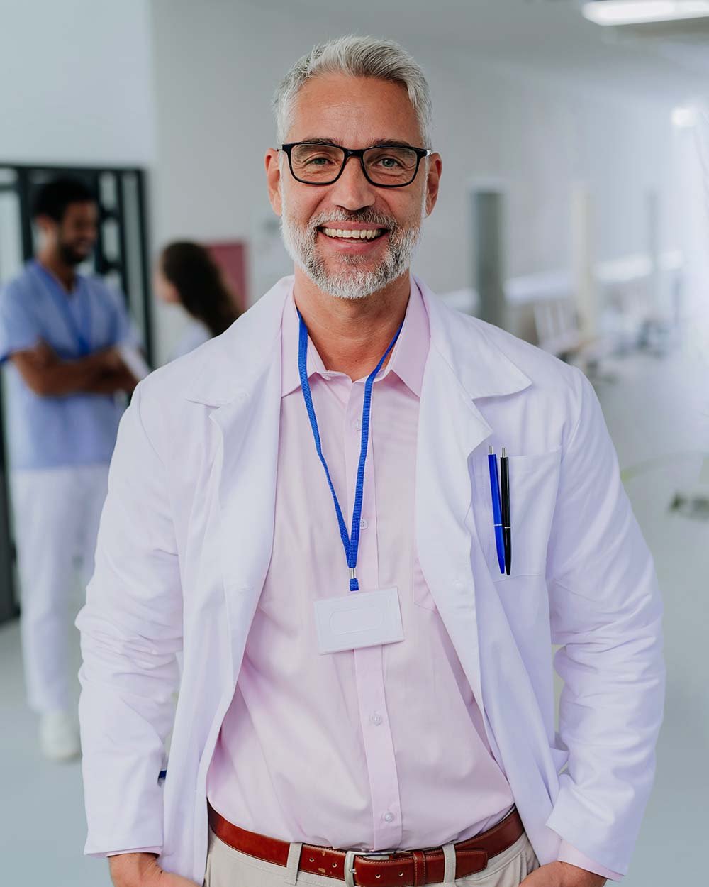 portrait-of-happy-doctor-at-hospital-corridor2-CX3VSGM.jpg